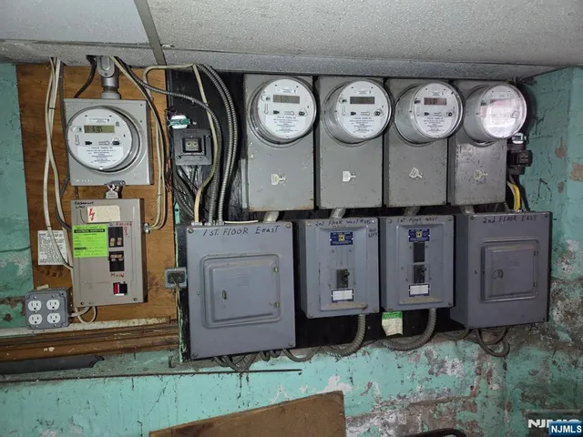a view of a wooden bench and a clock on a wall