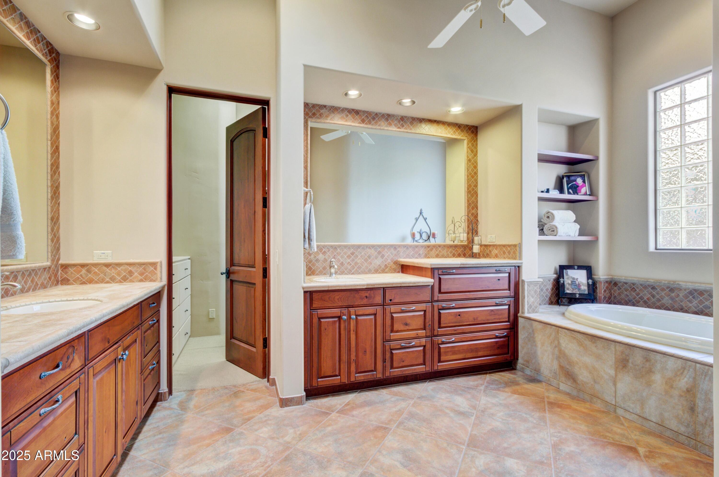 28013 Desierto Drive Rio Verde, AZ 85263 - Photo 14 of 33 a spacious bathroom with a tub sink and mirror