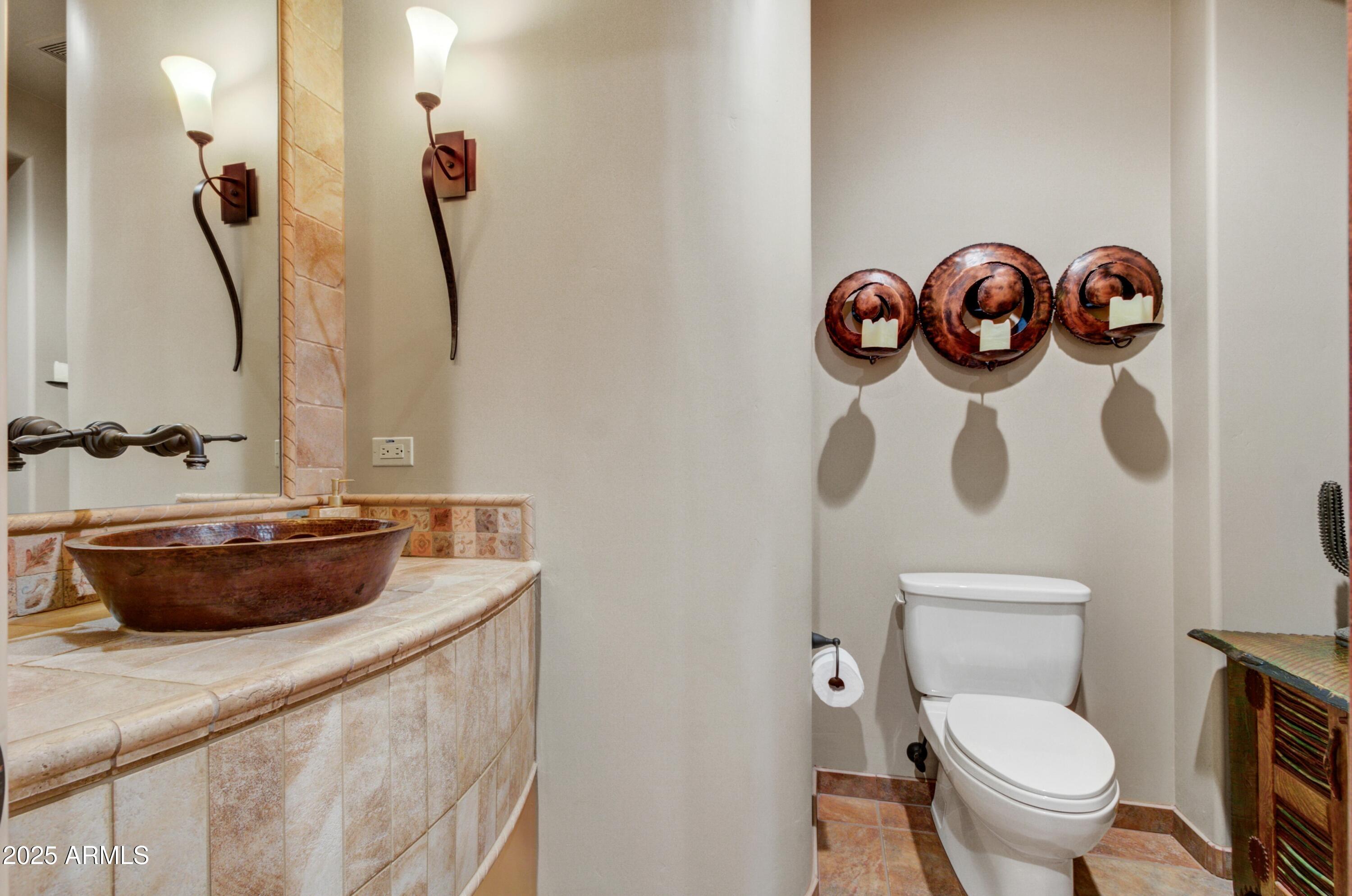 28013 Desierto Drive Rio Verde, AZ 85263 - Photo 20 of 33 a bathroom with a toilet and a sink