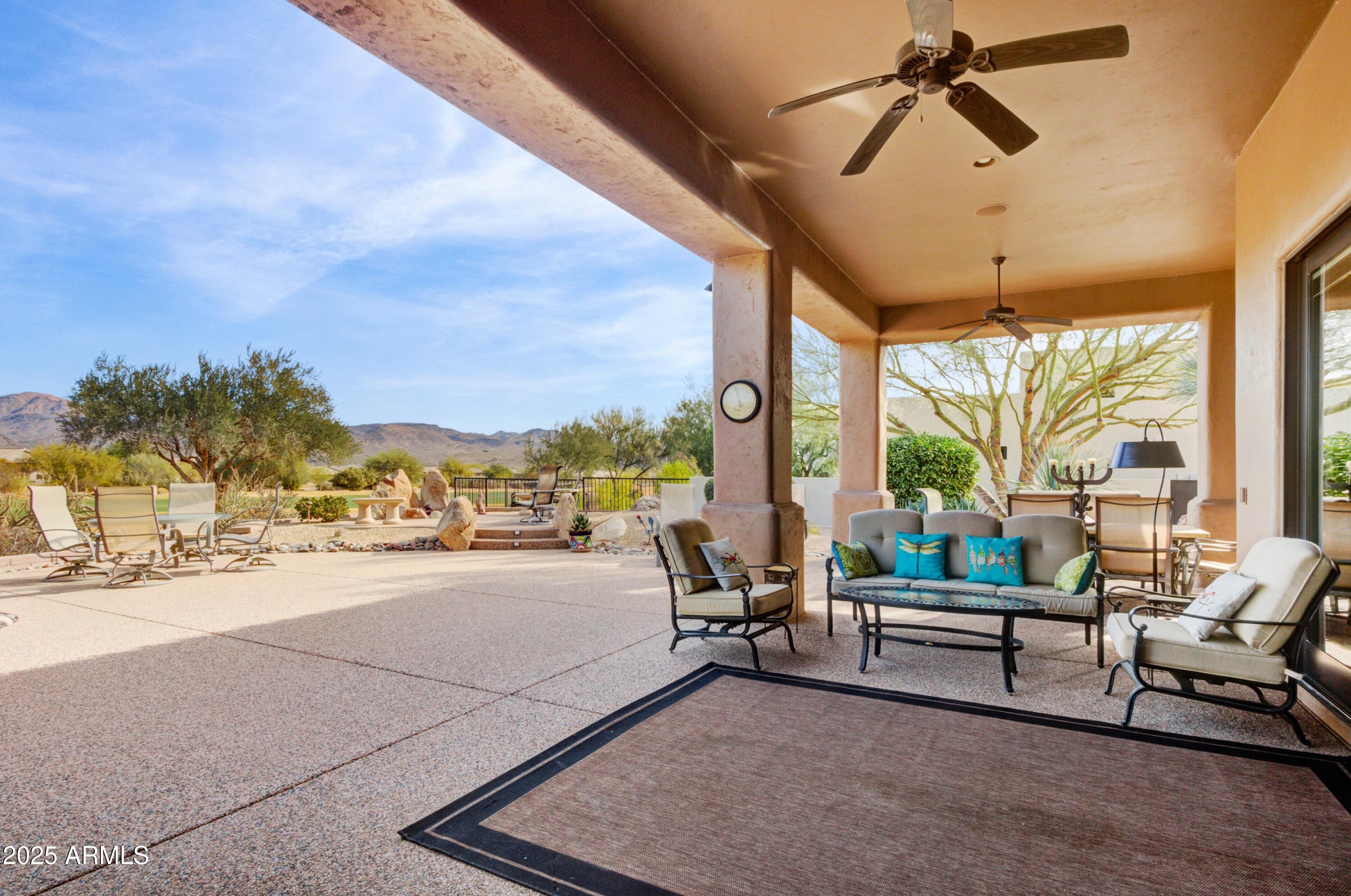 28013 Desierto Drive Rio Verde, AZ 85263 - Photo 21 of 33 a living room with furniture and a large window