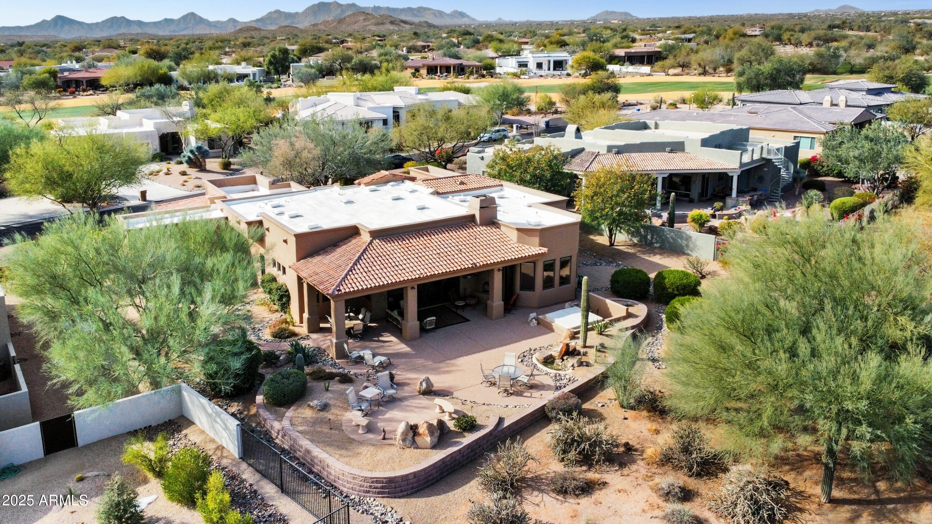 28013 Desierto Drive Rio Verde, AZ 85263 - Photo 27 of 33 an aerial view of a house with yard swimming pool and mountain view in back