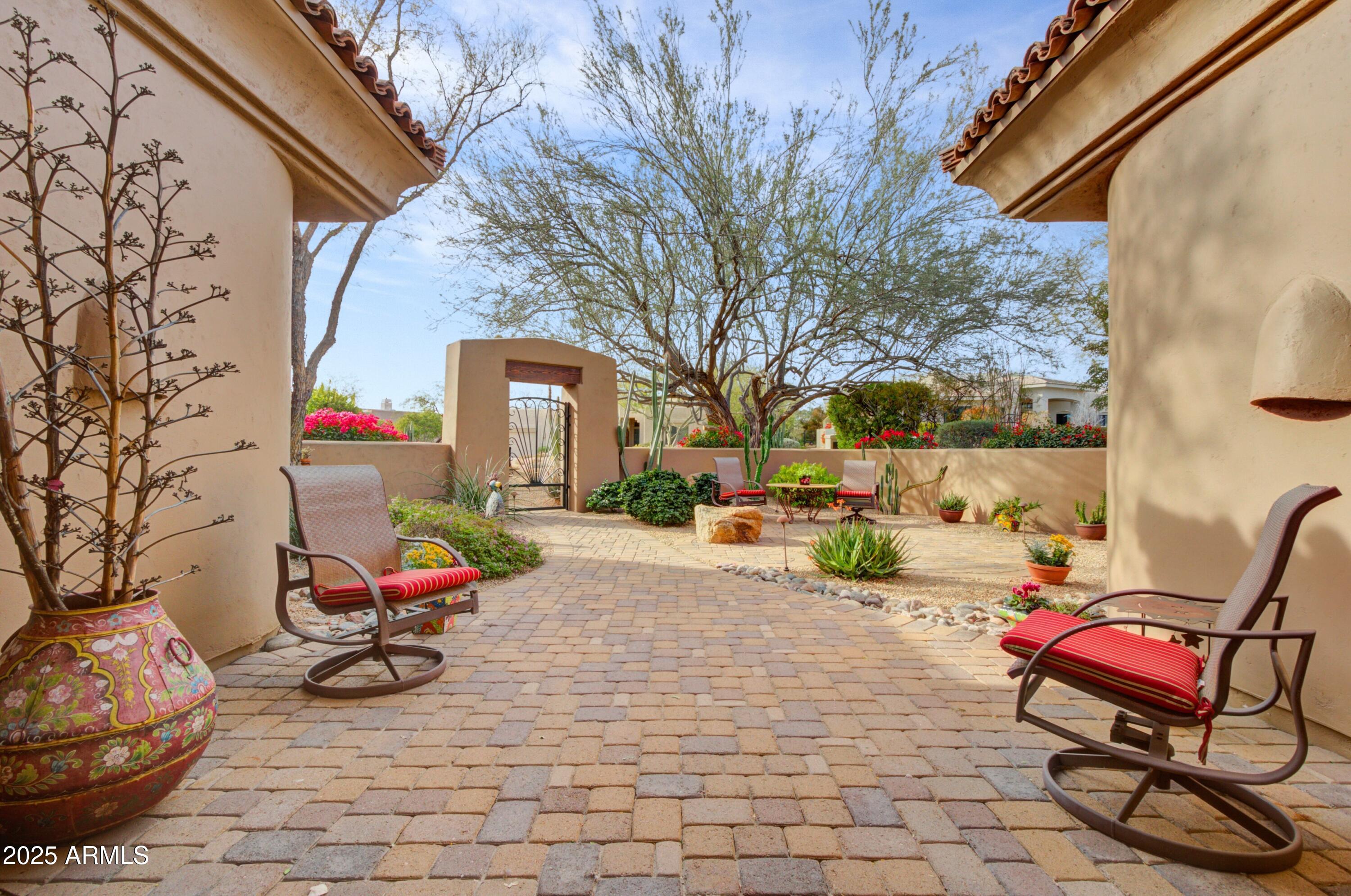 28013 Desierto Drive Rio Verde, AZ 85263 - Photo 5 of 33 a building outdoor space with furniture and couch