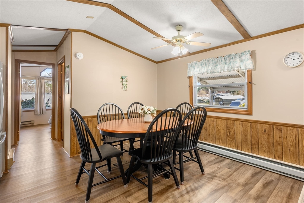 231 Park Circle Sturbridge, MA 01566 - Photo 12 of 32 a dining room with furniture a chandelier and wooden floor