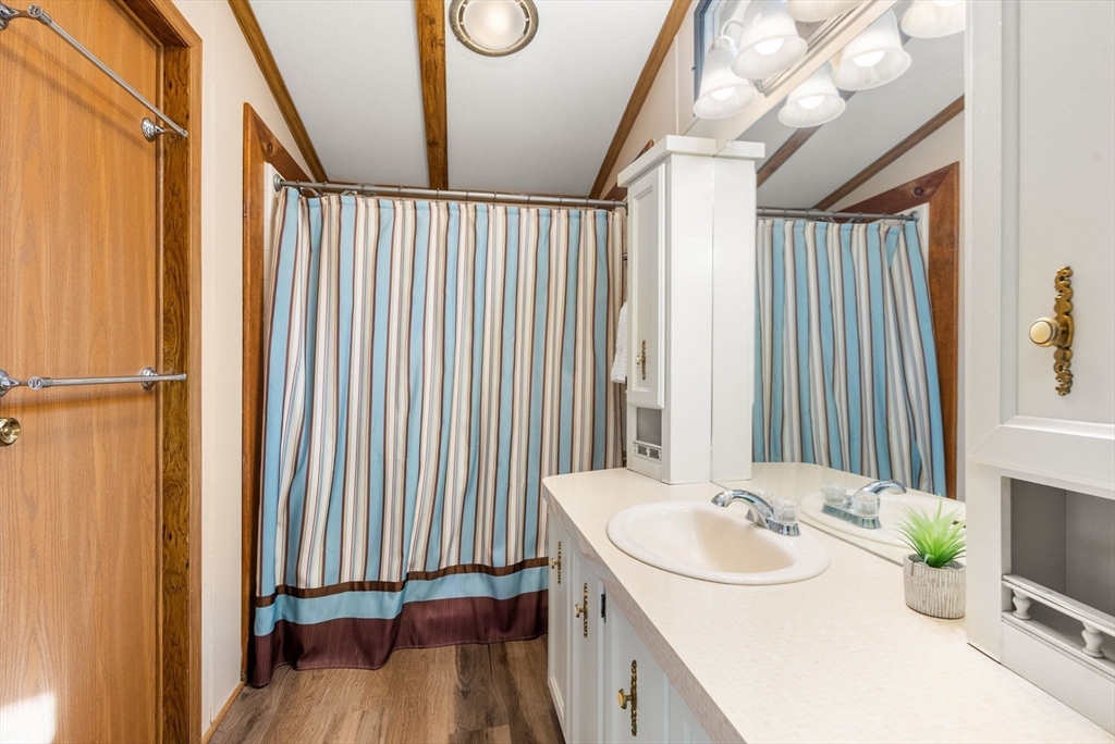 231 Park Circle Sturbridge, MA 01566 - Photo 19 of 32 a bathroom with a sink and a mirror