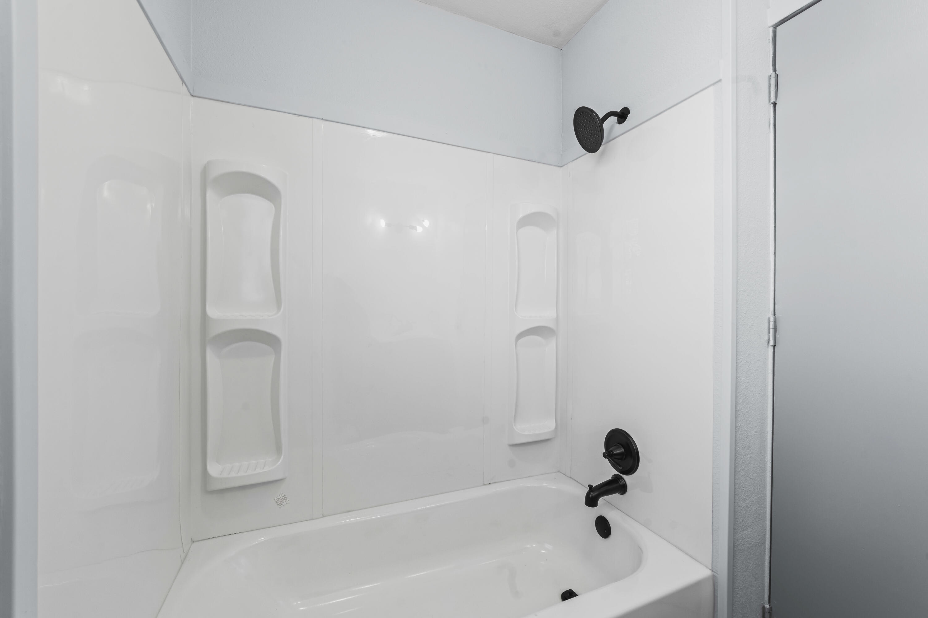 3017 East 3rd Street Lubbock, TX 79403 - Photo 11 of 15 a bathroom with a bathtub