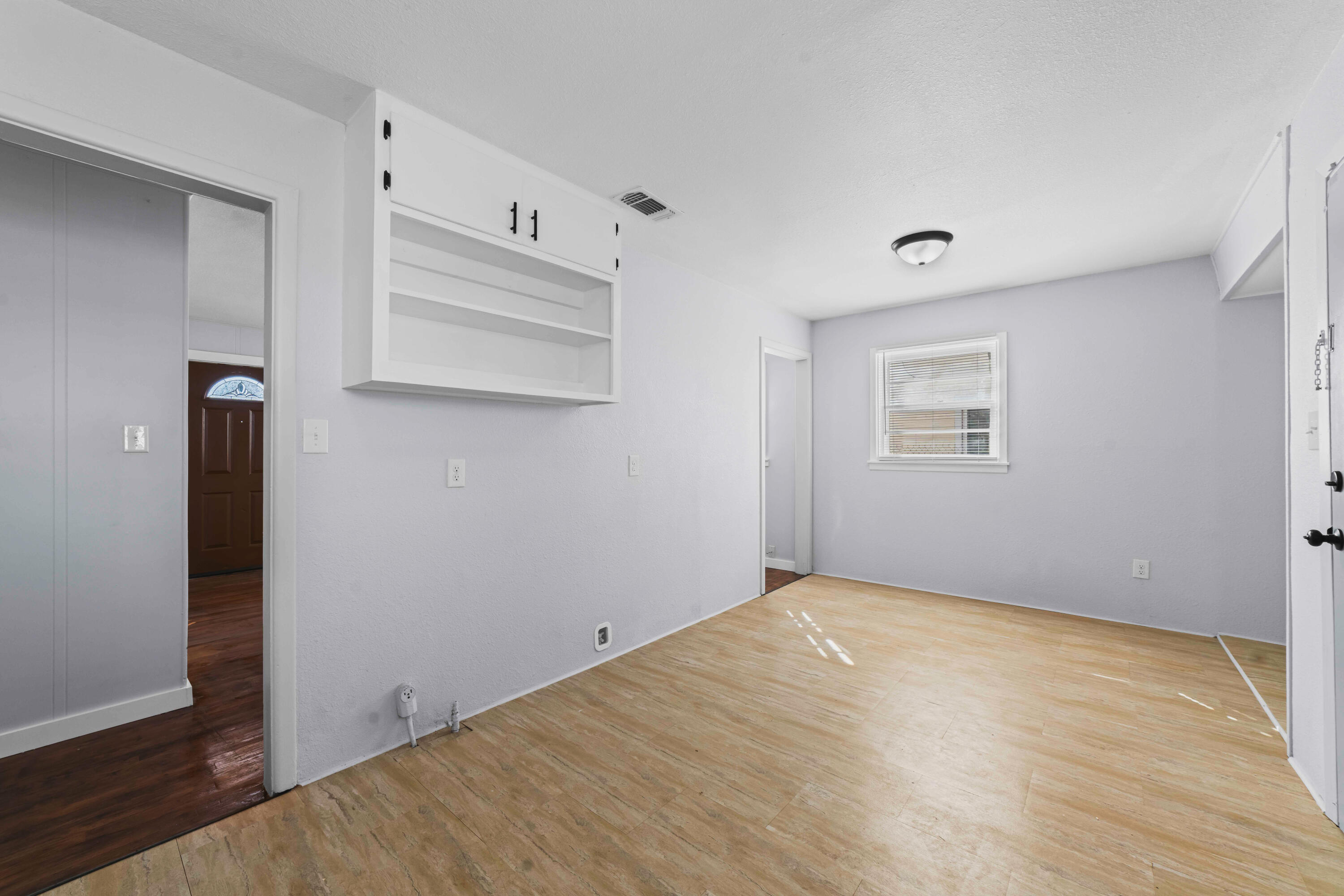 3017 East 3rd Street Lubbock, TX 79403 - Photo 5 of 15 wooden floor in an empty room