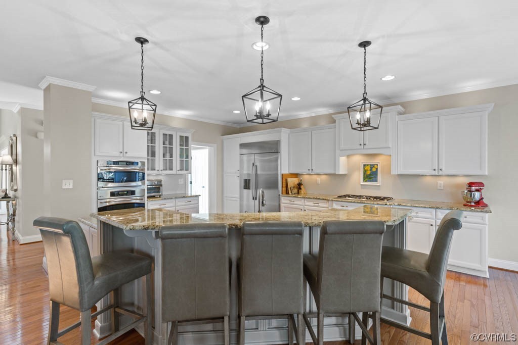 4318 Elmstone Road Midlothian, VA 23113 - Photo 12 of 47 a kitchen that has a table and chairs in it