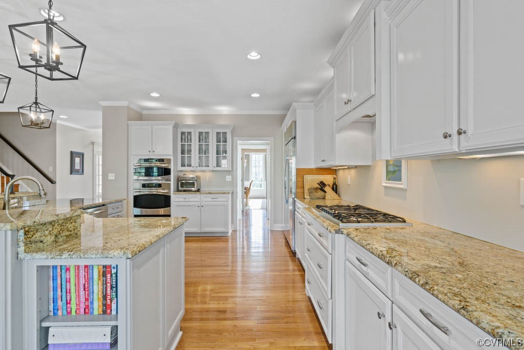 4318 Elmstone Road Midlothian, VA 23113 - Photo 13 of 47 a kitchen with stainless steel appliances granite countertop a stove and a sink