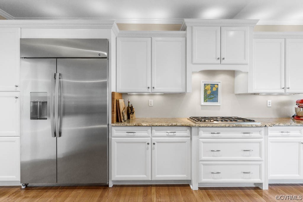 4318 Elmstone Road Midlothian, VA 23113 - Photo 14 of 47 a kitchen with granite countertop a refrigerator and a stove top oven