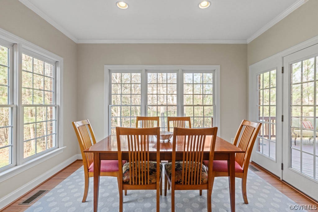 4318 Elmstone Road Midlothian, VA 23113 - Photo 16 of 47 a view of a dining room with furniture and windows
