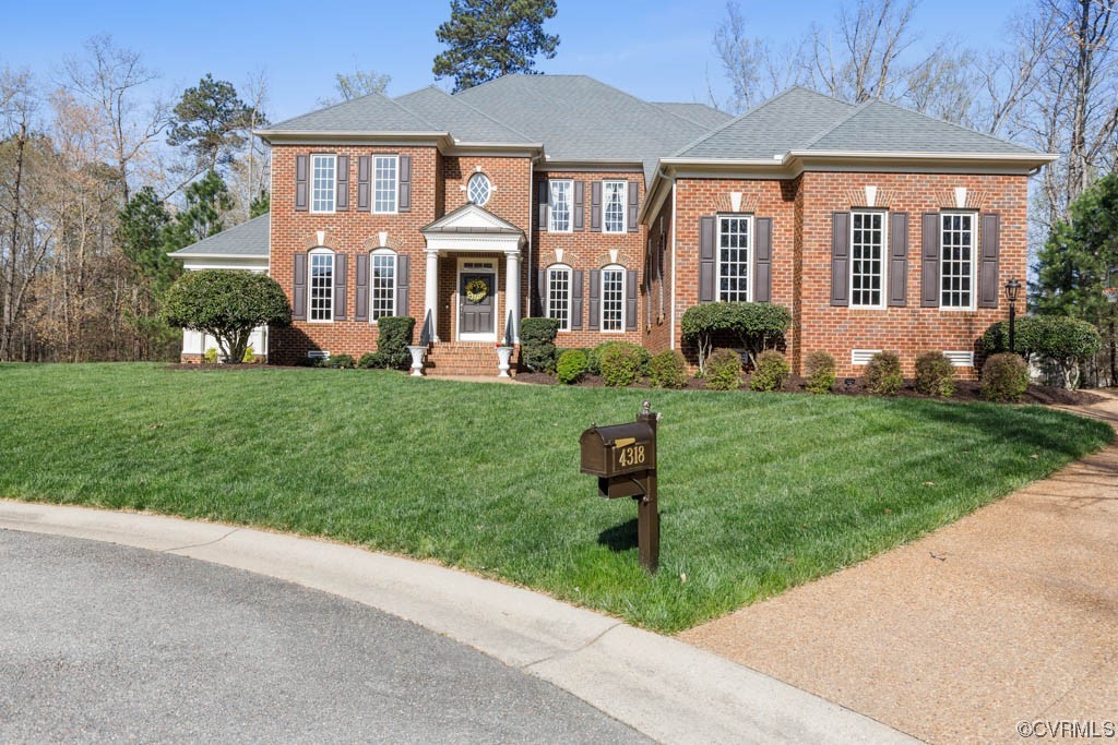 4318 Elmstone Road Midlothian, VA 23113 - Photo 2 of 47 a front view of a house with a yard and garage