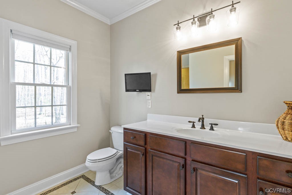 4318 Elmstone Road Midlothian, VA 23113 - Photo 25 of 47 a bathroom with a toilet a sink a window and mirror