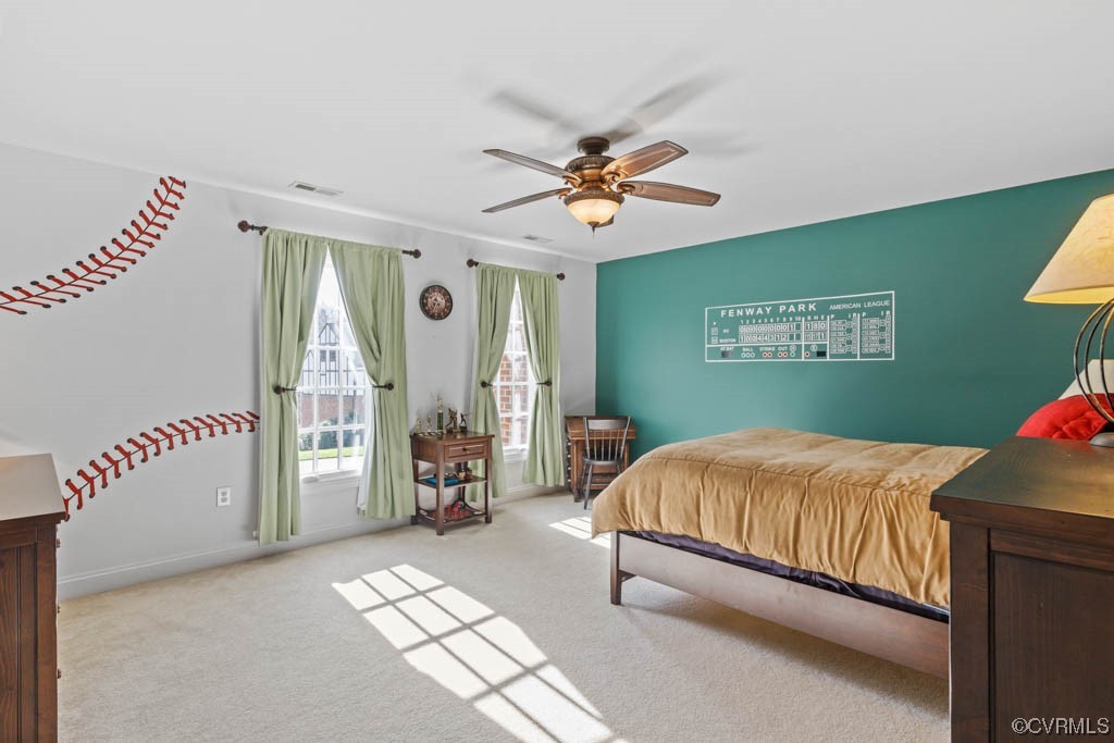 4318 Elmstone Road Midlothian, VA 23113 - Photo 30 of 47 a bedroom with a bed and a chandelier