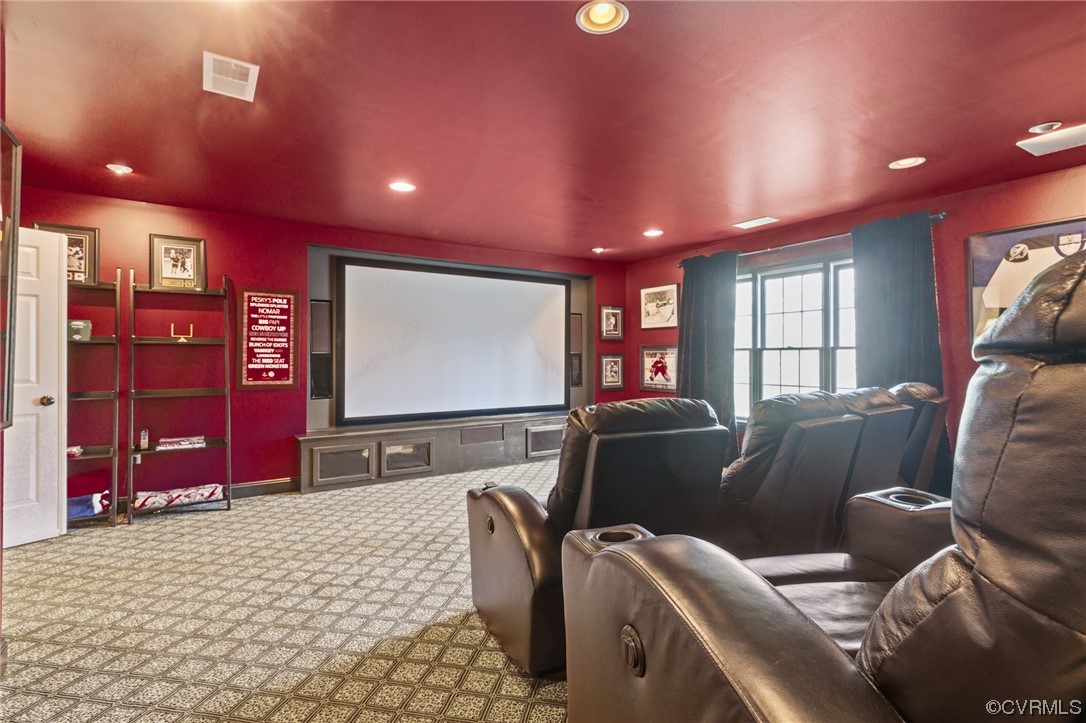 4318 Elmstone Road Midlothian, VA 23113 - Photo 41 of 47 a media room with lots of chairs and a projector screen
