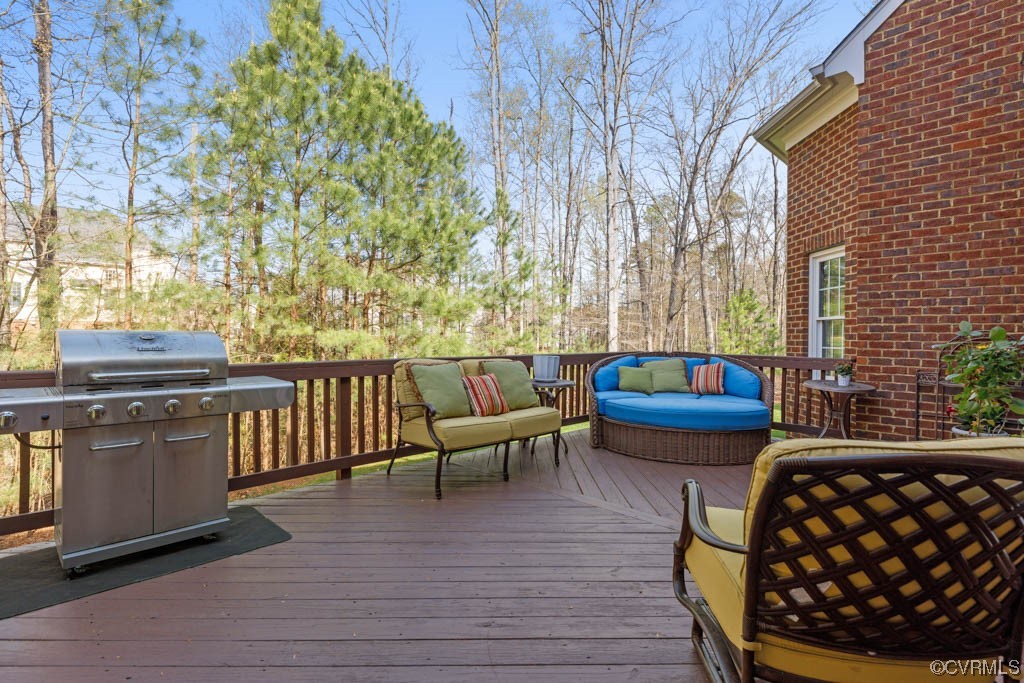 4318 Elmstone Road Midlothian, VA 23113 - Photo 45 of 47 a balcony with wooden floor table and chairs