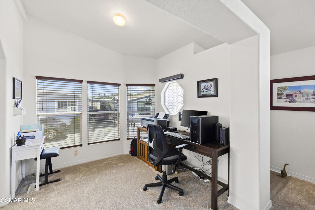 195 Tierra Rejada Road, Unit 52 Simi Valley, CA 93065 - Photo 13 of 34 a view of a workspace with furniture and a window