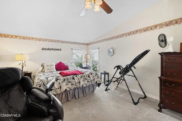 a view of a dining room with furniture and a rug