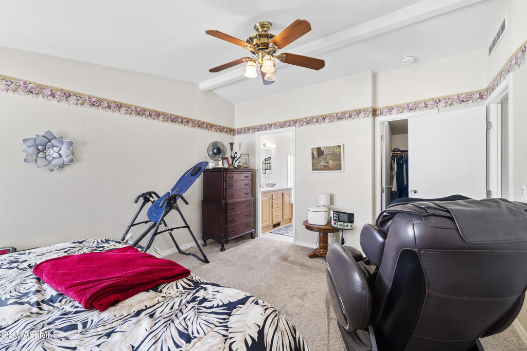 195 Tierra Rejada Road, Unit 52 Simi Valley, CA 93065 - Photo 15 of 34 a bedroom with furniture and a bed