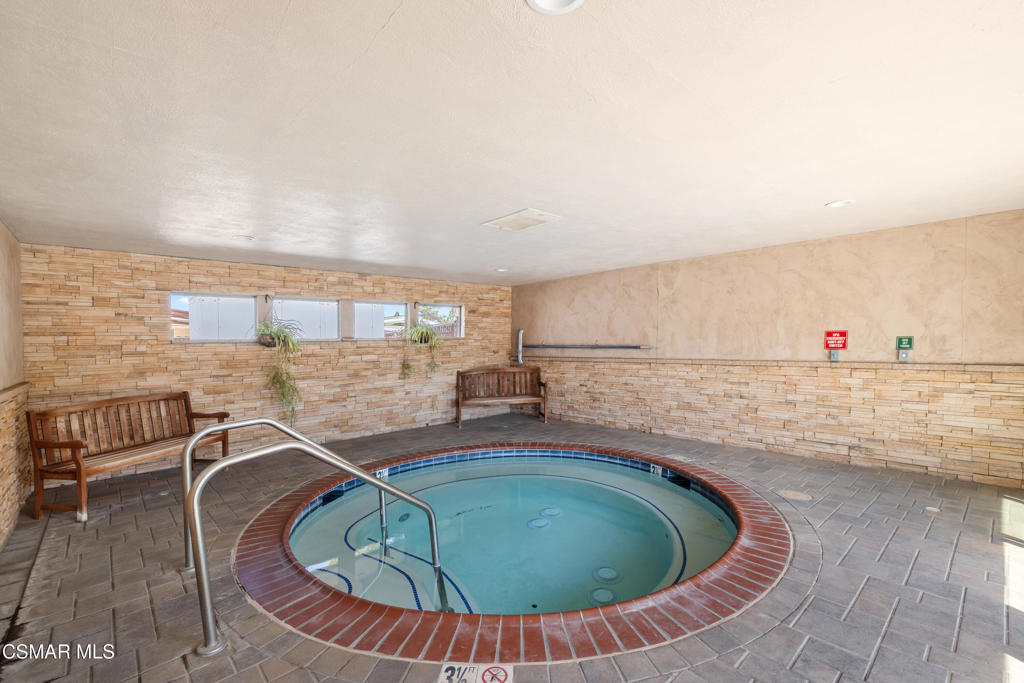 195 Tierra Rejada Road, Unit 52 Simi Valley, CA 93065 - Photo 30 of 34 a room with wooden floor and seating space