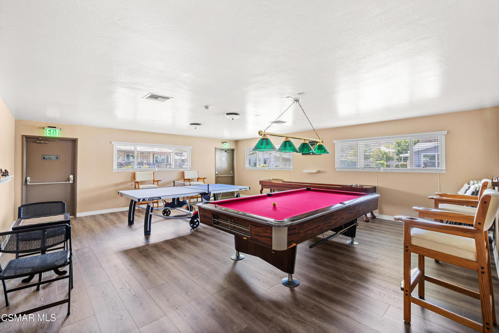 195 Tierra Rejada Road, Unit 52 Simi Valley, CA 93065 - Photo 32 of 34 a room with furniture pool table and wooden floor