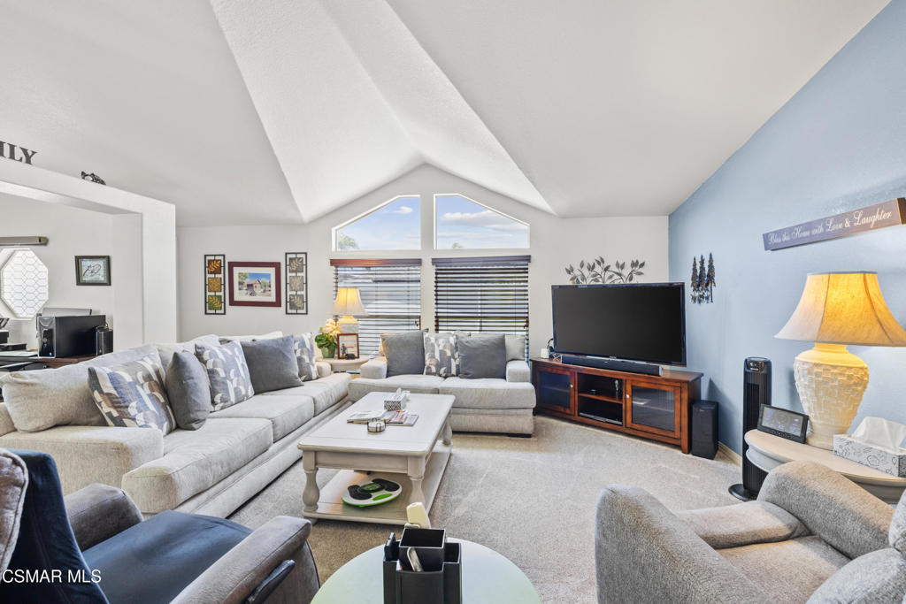 195 Tierra Rejada Road, Unit 52 Simi Valley, CA 93065 - Photo 5 of 34 a living room with furniture and a flat screen tv