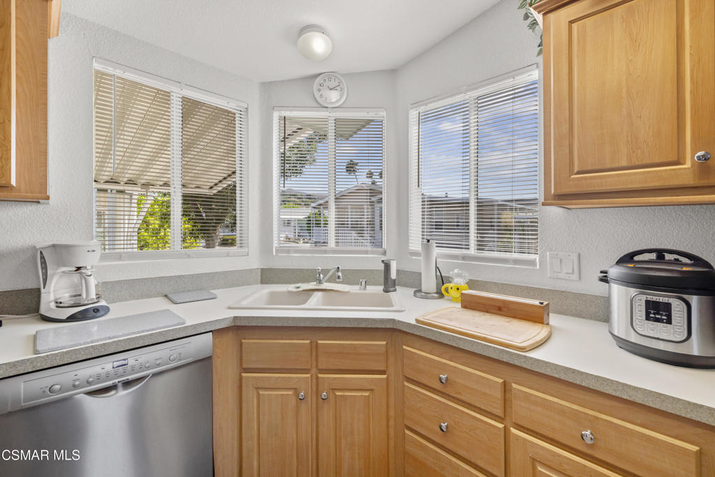 195 Tierra Rejada Road, Unit 52 Simi Valley, CA 93065 - Photo 10 of 34 a kitchen with sink and window