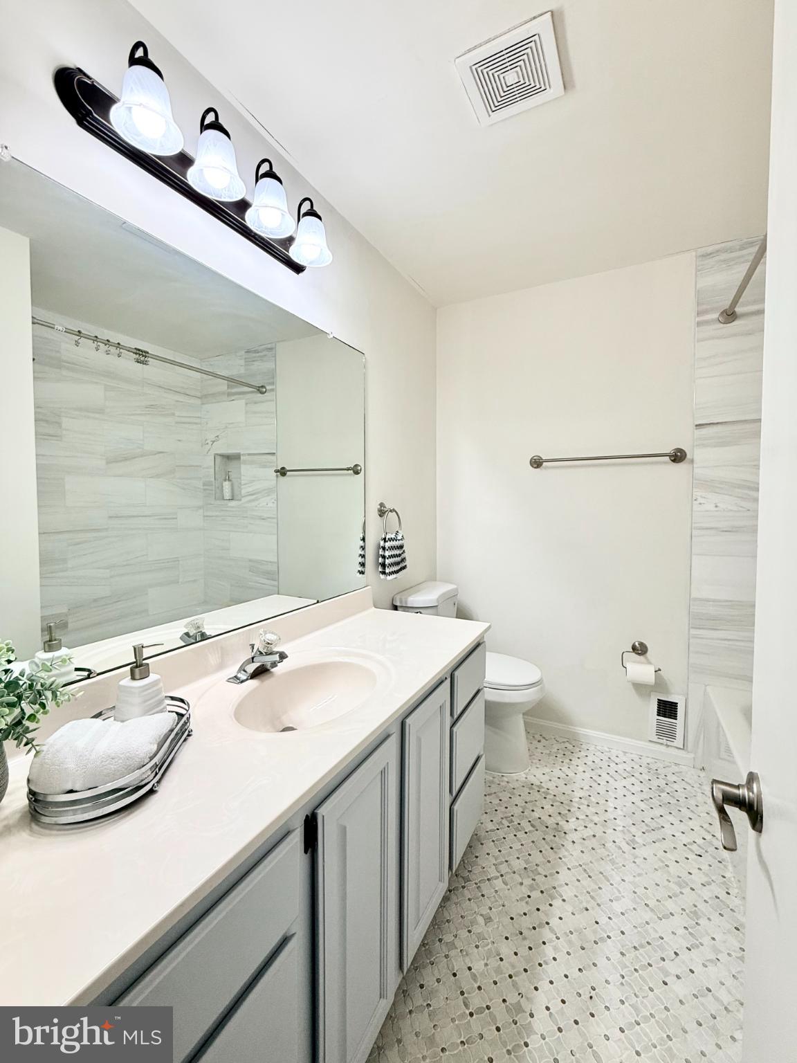 4024 Old Hickory Road Fairfax, VA 22032 - Photo 5 of 6 a bathroom with a sink a toilet and shower