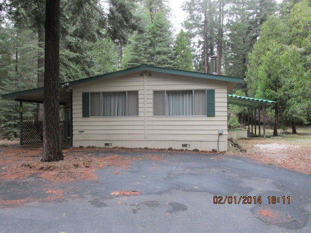 9264 Thatcher Road Shingletown, CA 96088 - Photo 1 of 13 a view of a house with a backyard
