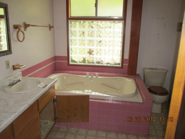 9264 Thatcher Road Shingletown, CA 96088 - Photo 10 of 13 a bath room with a sink and bath tub