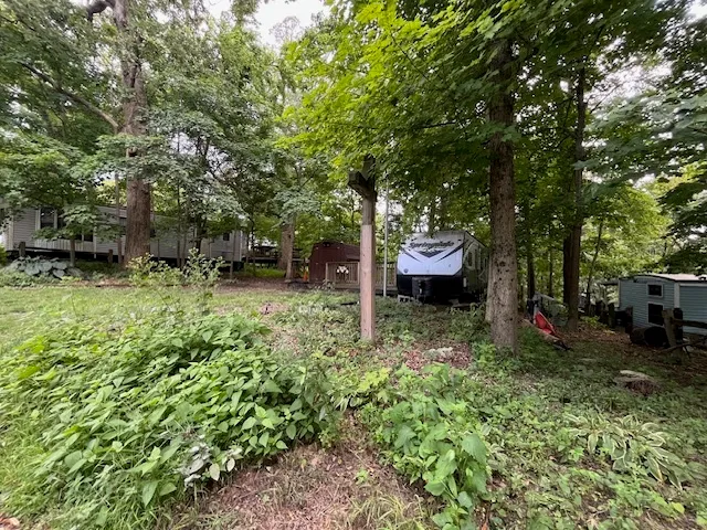 a backyard of a house with outdoor seating