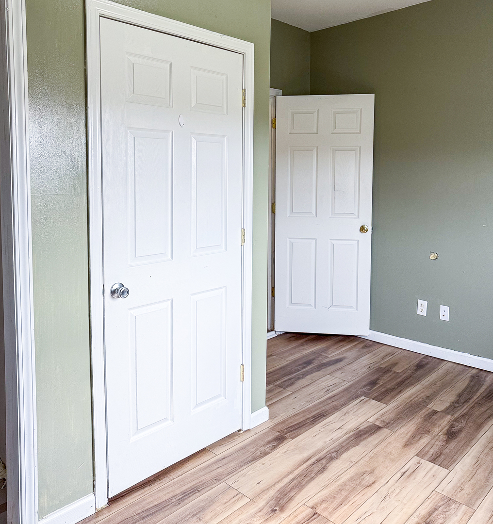 319 Missouri Street Atwood, IL 61913 - Photo 16 of 22 a view of an empty room with wooden floor