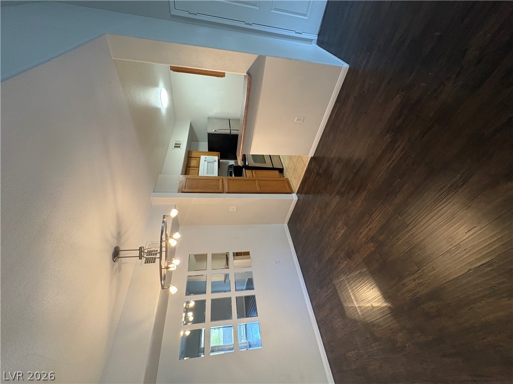 7255 West Sunset Road, Unit 2023 Las Vegas, NV 89113 - Photo 9 of 24 Gleaming hardwood floors connect the dining area directly to the adjoining kitchen.