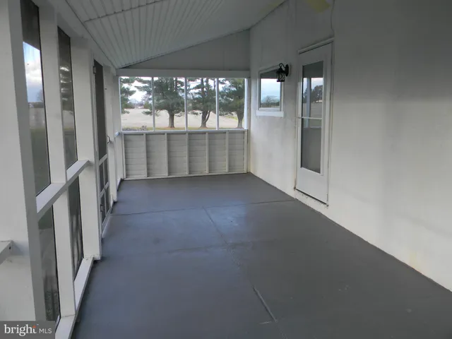 wooden floor in an empty room with a fireplace