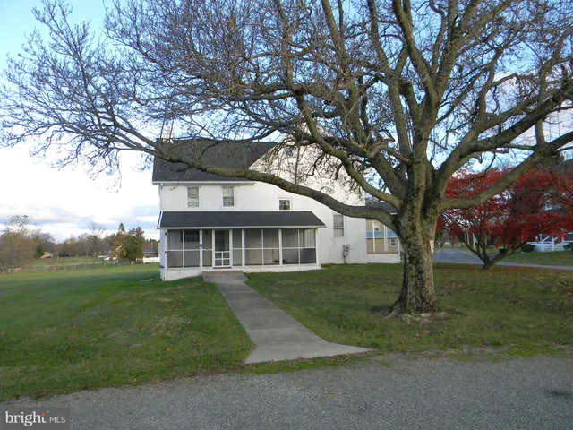 front view of a house with a garden