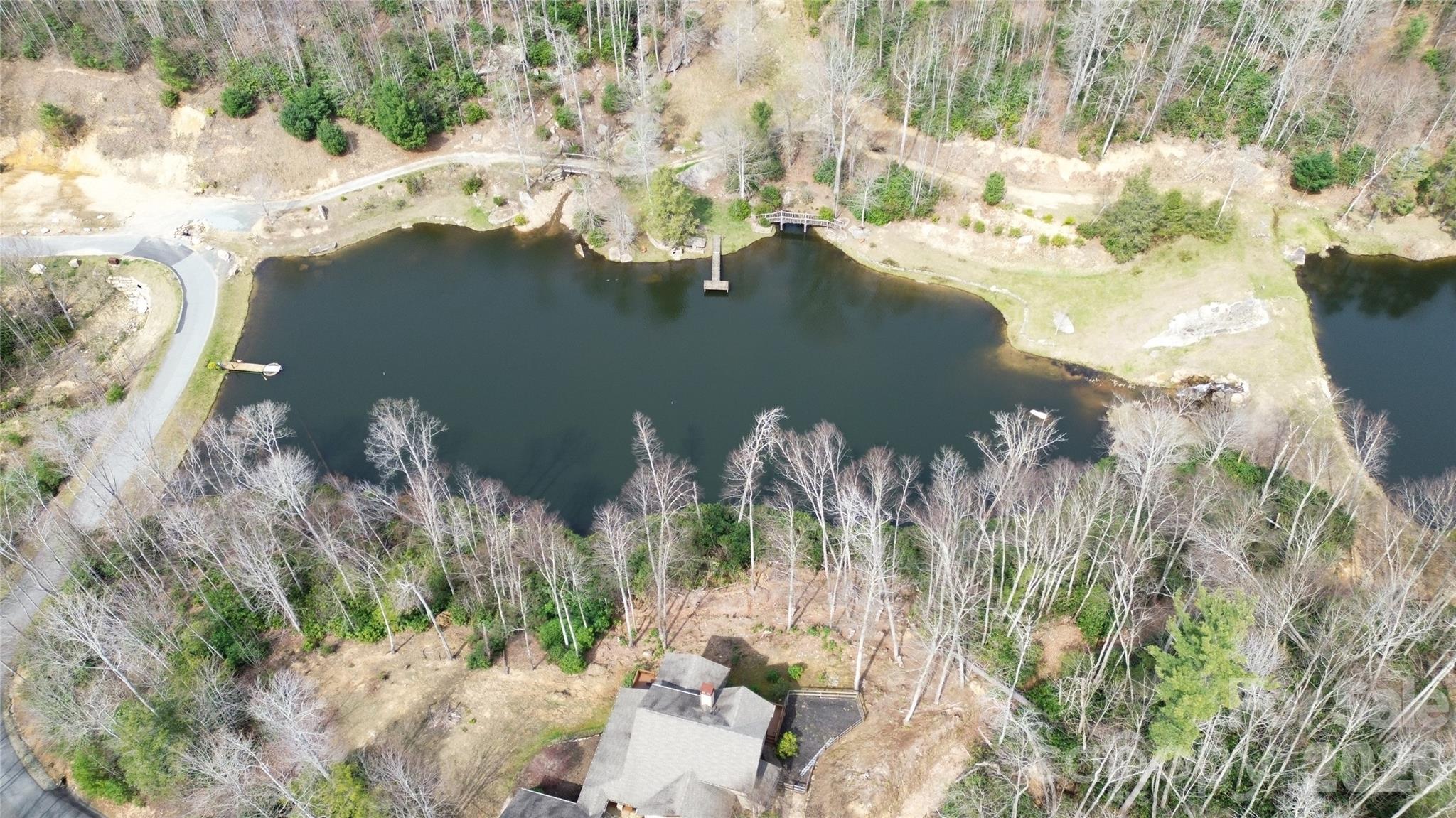 0 Woodlake Loop Road Elk Park, NC 28622 - Photo 14 of 29 a view of a lake with a yard