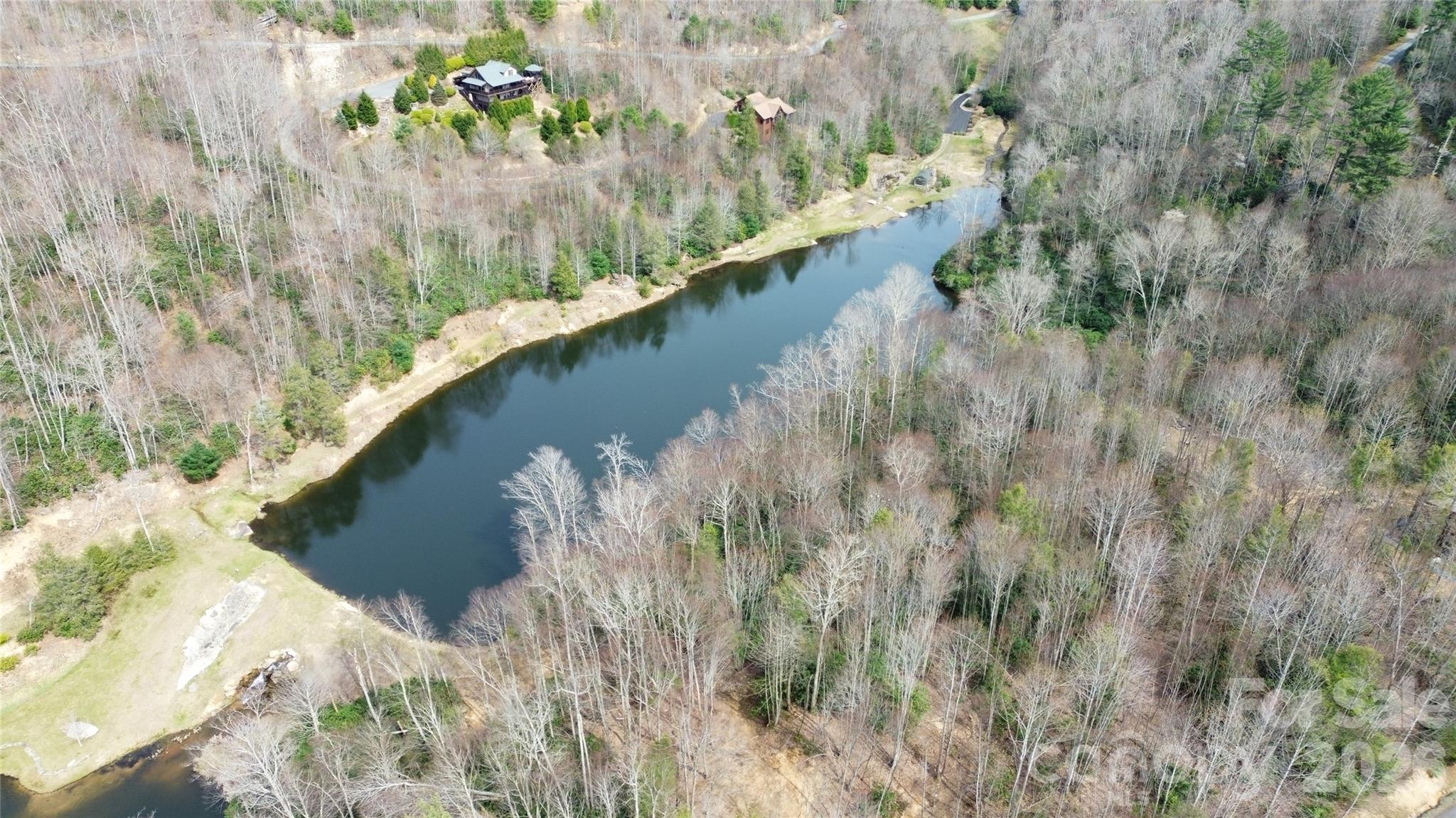 0 Woodlake Loop Road Elk Park, NC 28622 - Photo 15 of 29 a view of a lake from a forest