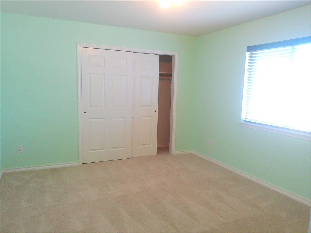 5405 Knights Circle Corpus Christi, TX 78413 - Photo 14 of 18 an empty room with windows