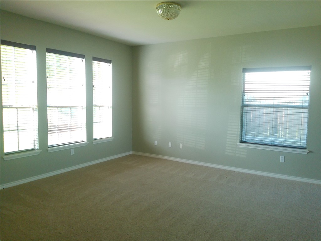 5405 Knights Circle Corpus Christi, TX 78413 - Photo 2 of 18 an empty room with windows