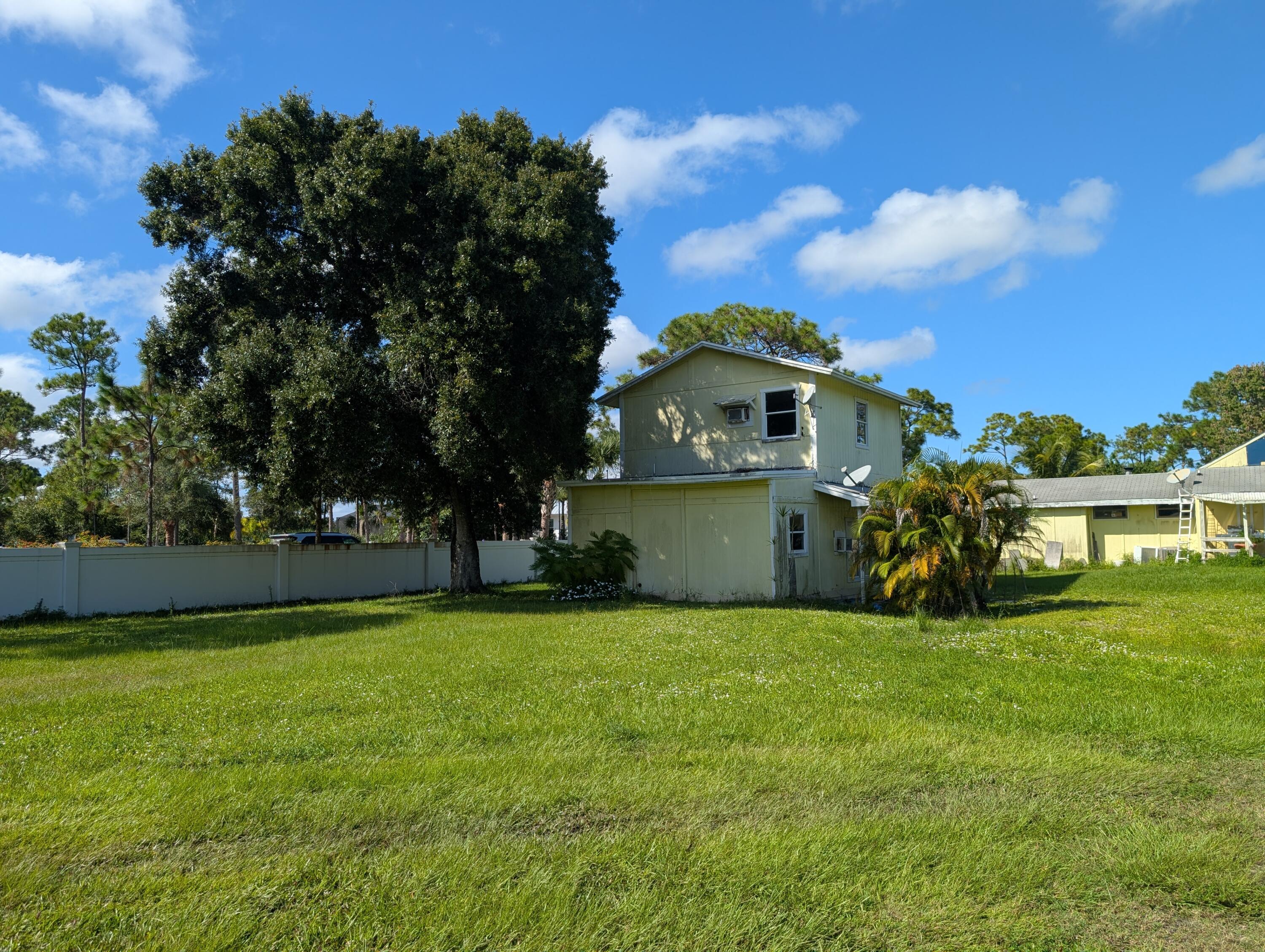 1500 Southeast Cove Road Stuart, FL 34997 - Photo 20 of 24 a view of a house with a yard