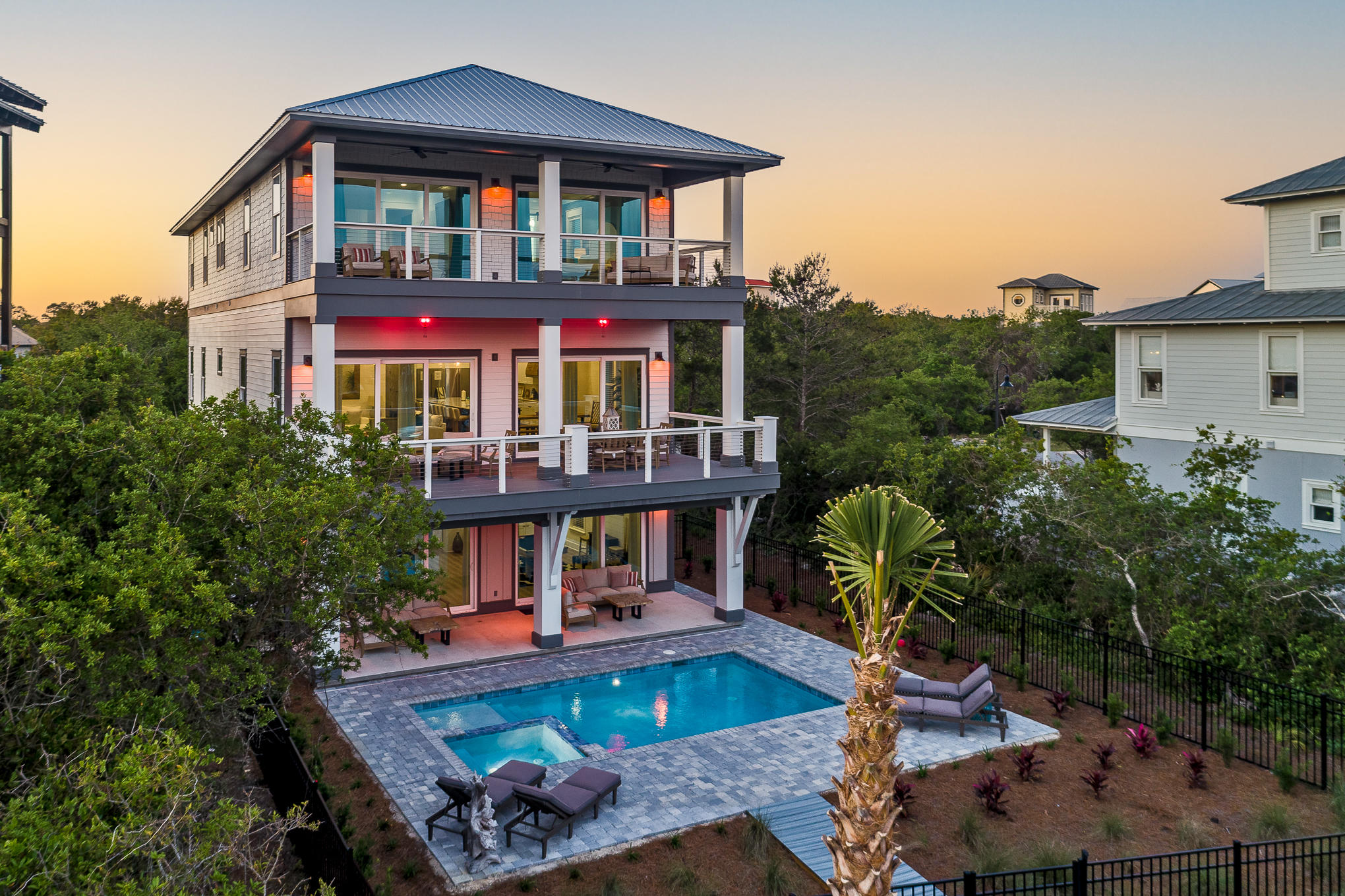 8427 East County Highway Seacrest, FL 32461 - Photo 1 of 74 a front view of house with yard and trees in the background