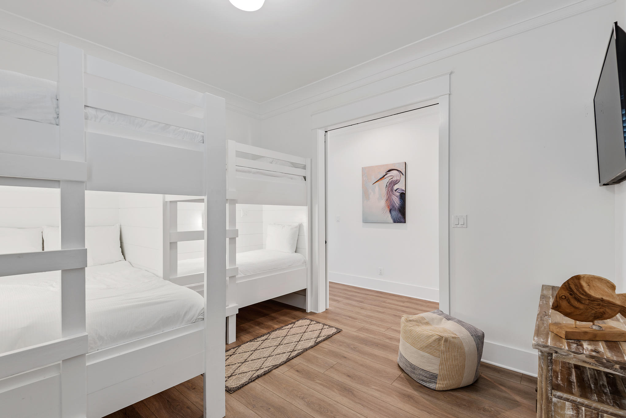 8427 East County Highway Seacrest, FL 32461 - Photo 17 of 74 a bedroom with a bed and wooden floor