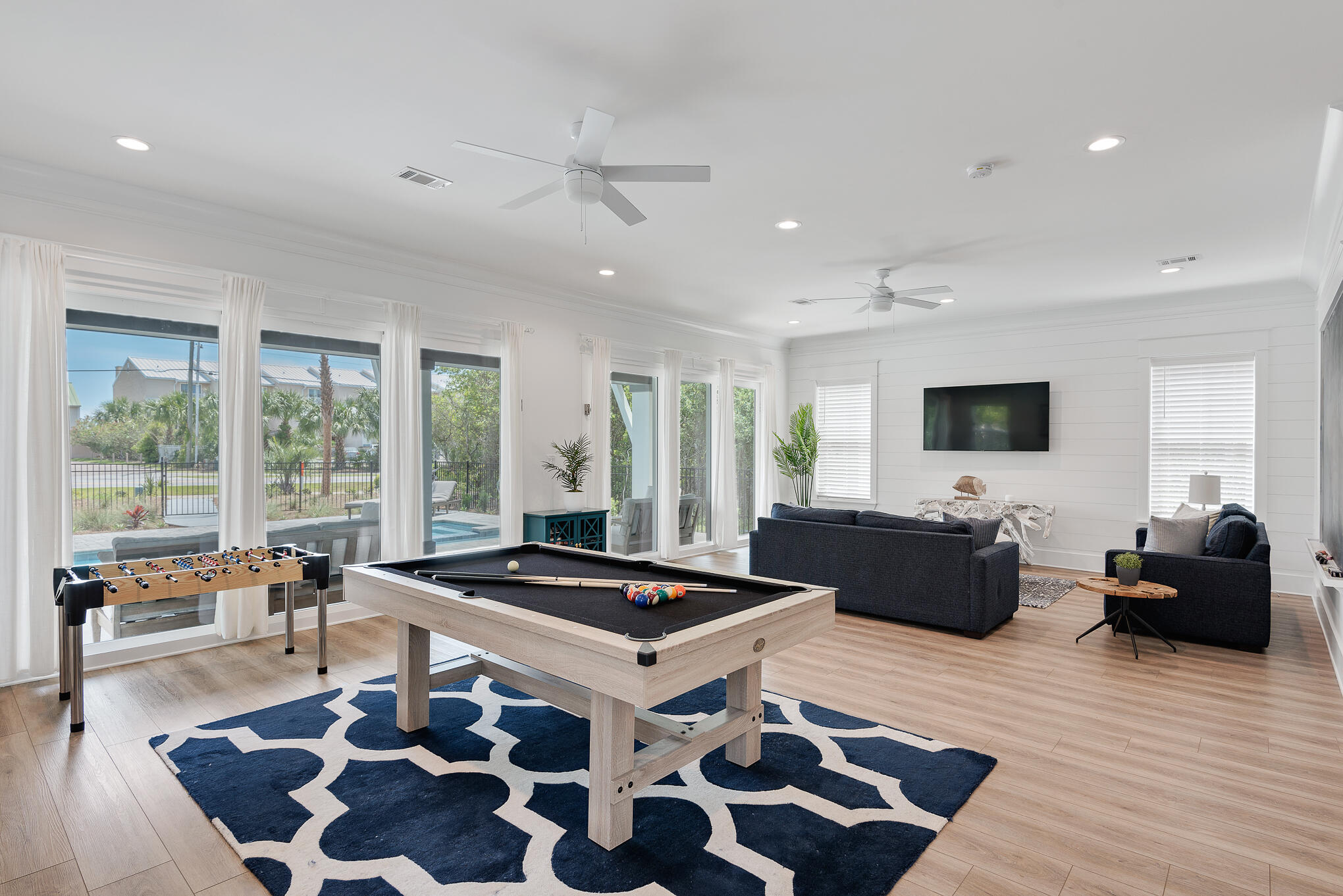 8427 East County Highway Seacrest, FL 32461 - Photo 20 of 74 a living room with furniture and a flat screen tv