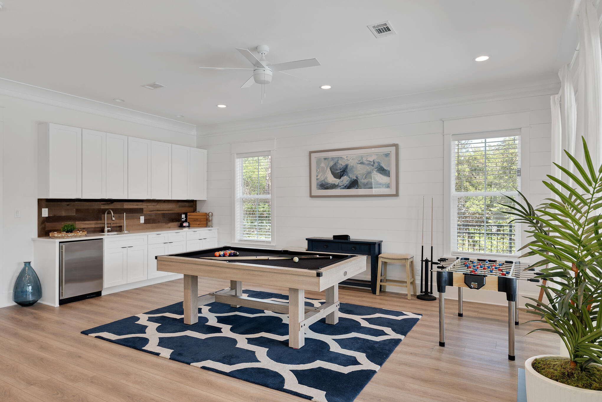8427 East County Highway Seacrest, FL 32461 - Photo 21 of 74 a living room with a stove and a window