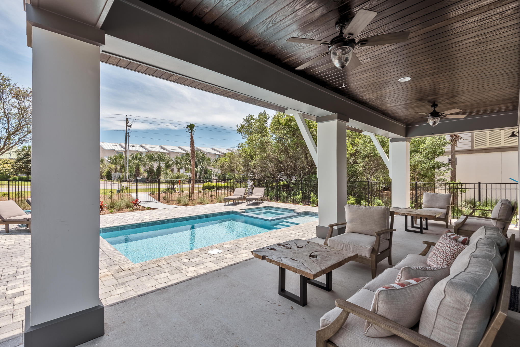8427 East County Highway Seacrest, FL 32461 - Photo 25 of 74 a living room with furniture and a floor to ceiling window
