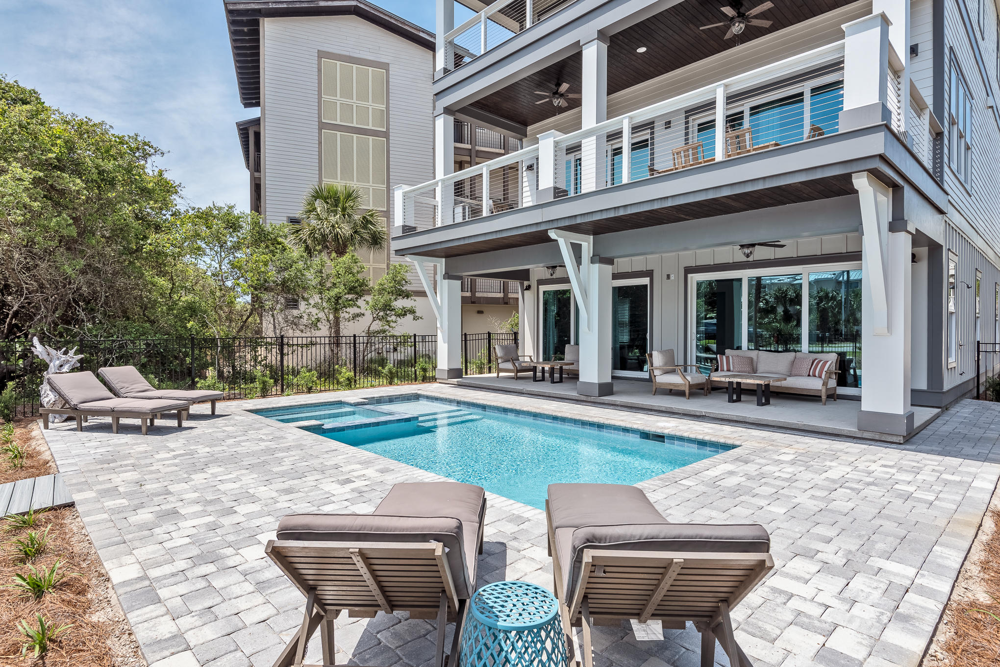 8427 East County Highway Seacrest, FL 32461 - Photo 26 of 74 a view of a house with swimming pool and sitting area
