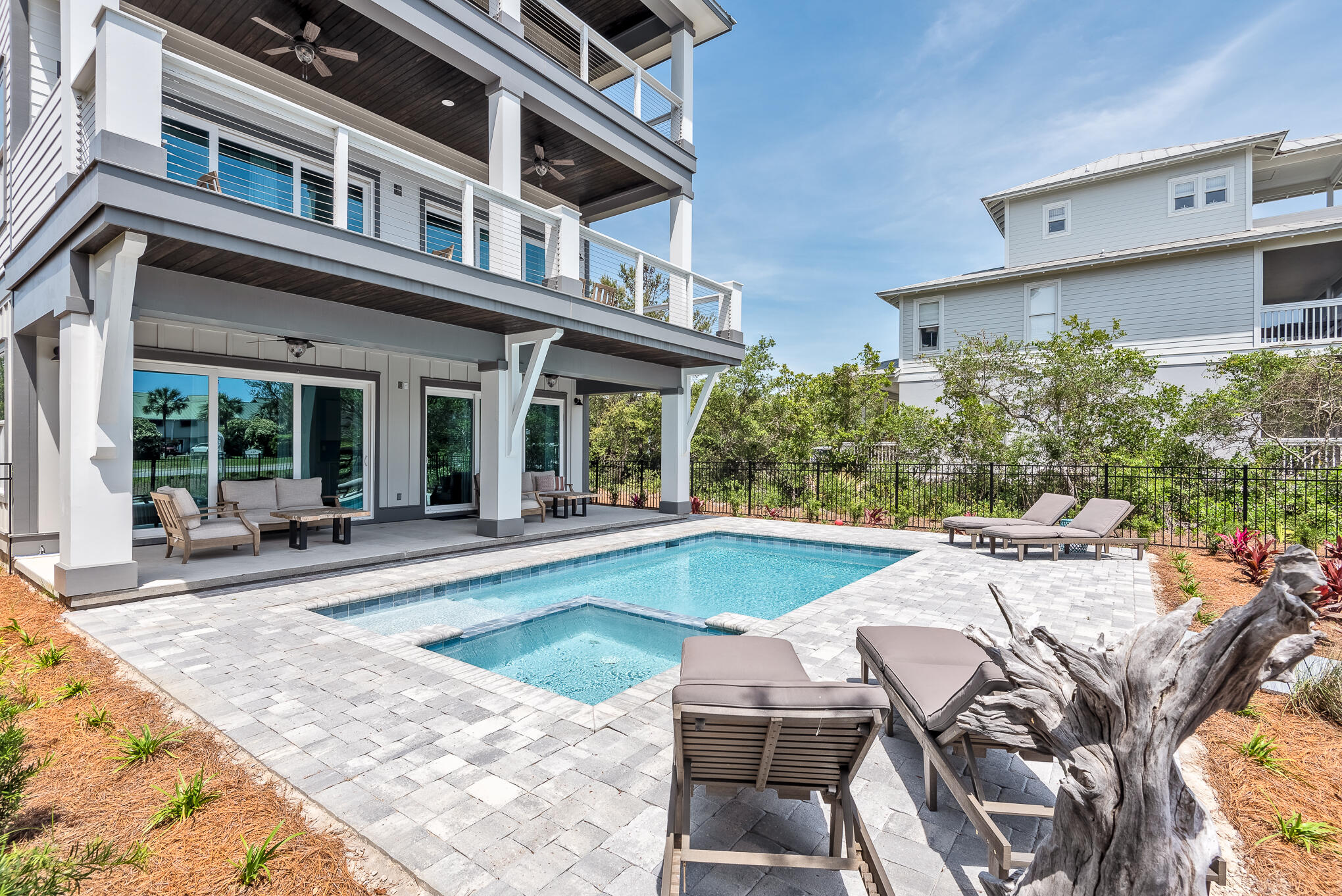 8427 East County Highway Seacrest, FL 32461 - Photo 28 of 74 a view of a house with swimming pool and sitting area