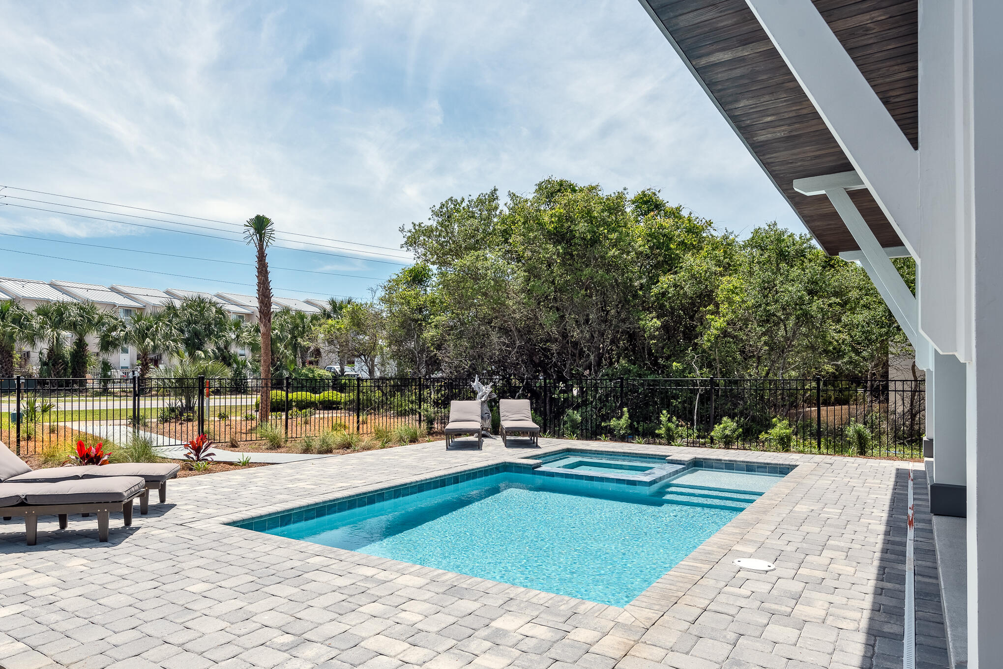 8427 East County Highway Seacrest, FL 32461 - Photo 29 of 74 a view of a swimming pool with a lounge chairs