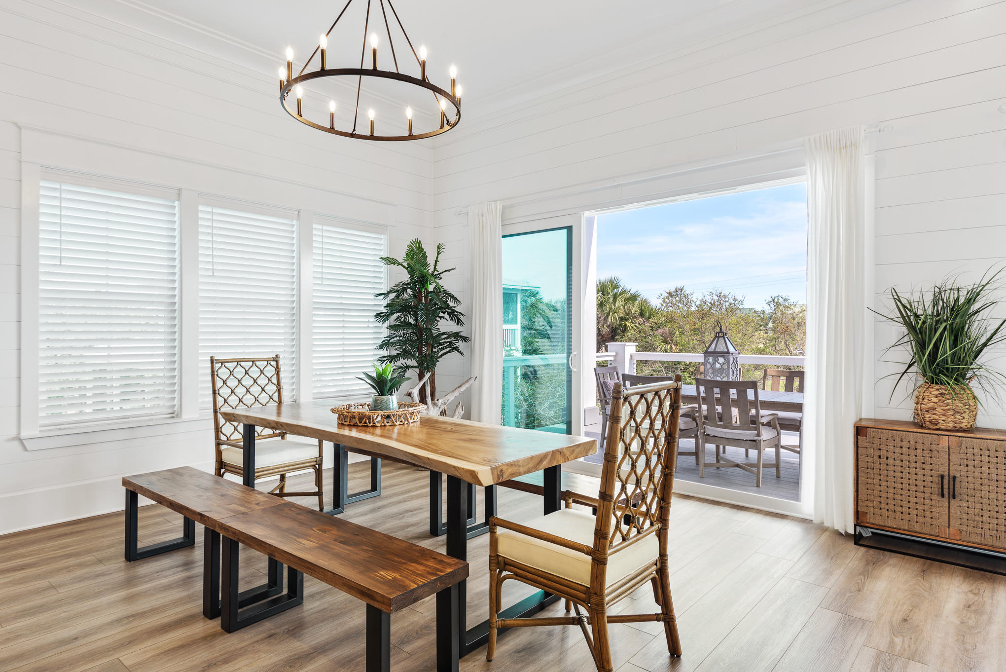 8427 East County Highway Seacrest, FL 32461 - Photo 36 of 74 a dining room with furniture window and wooden floor