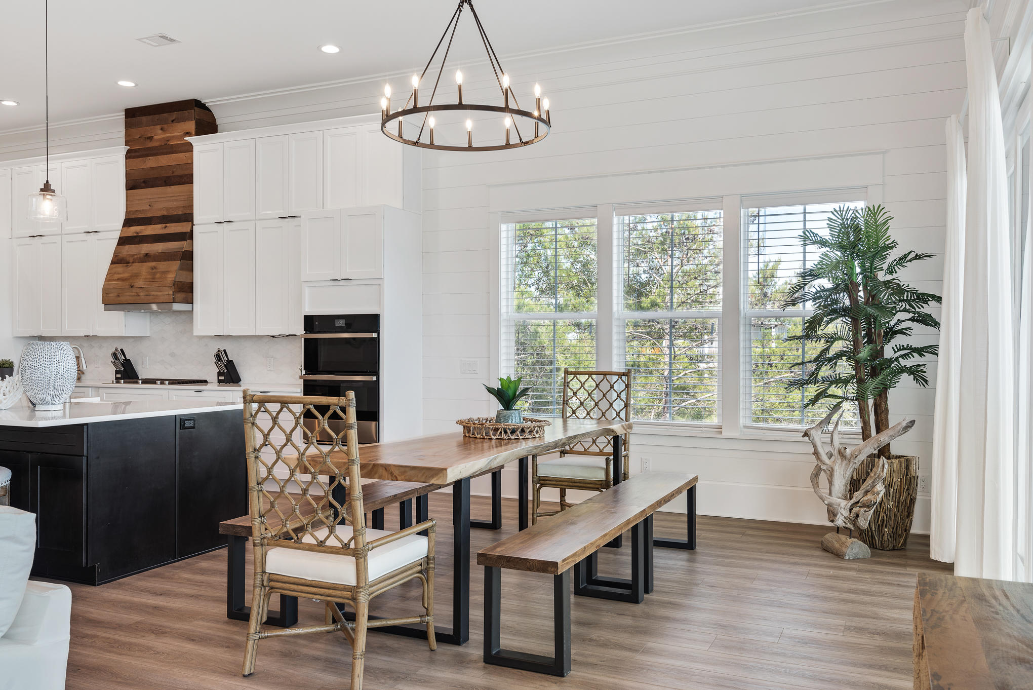 8427 East County Highway Seacrest, FL 32461 - Photo 38 of 74 a view of a dining room with furniture window and wooden floor