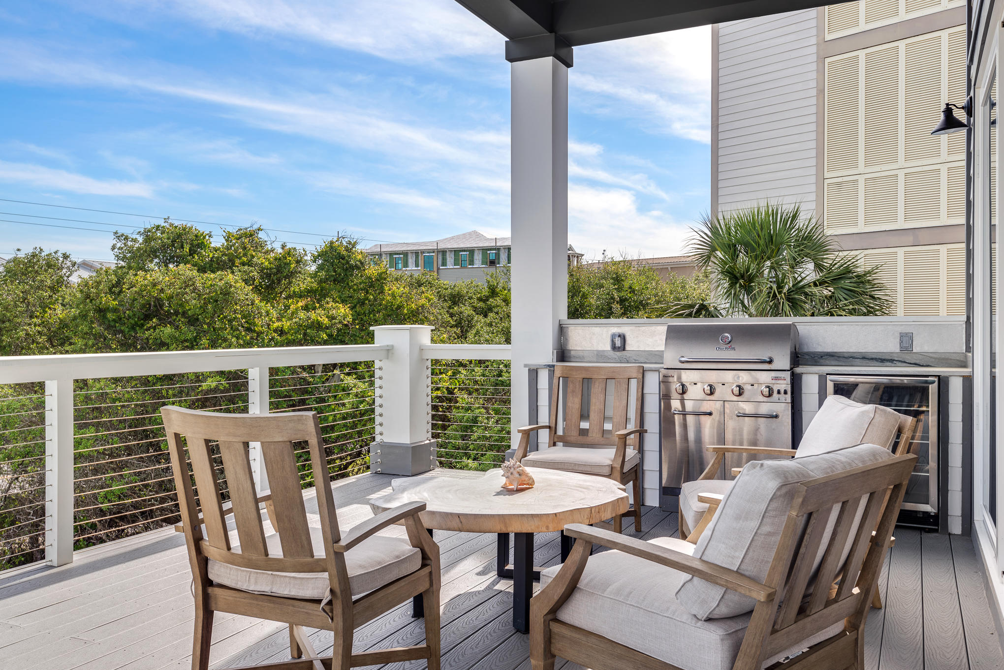 8427 East County Highway Seacrest, FL 32461 - Photo 40 of 74 a view of a balcony with a table and chairs
